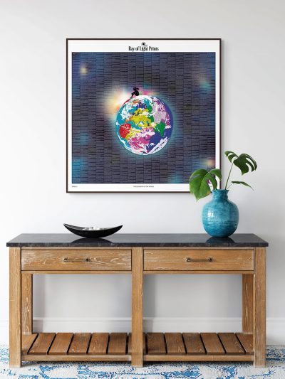 The Elements of the World print (Dark Edition) displayed on a wall above a console table in a styled interior.