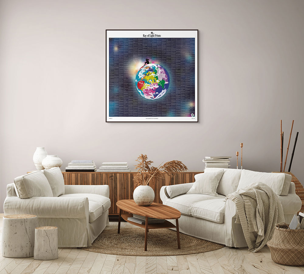 Neutral living room with cream armchairs and the Elements of the World print by Ray of Light Prints displayed above a wooden sideboard.